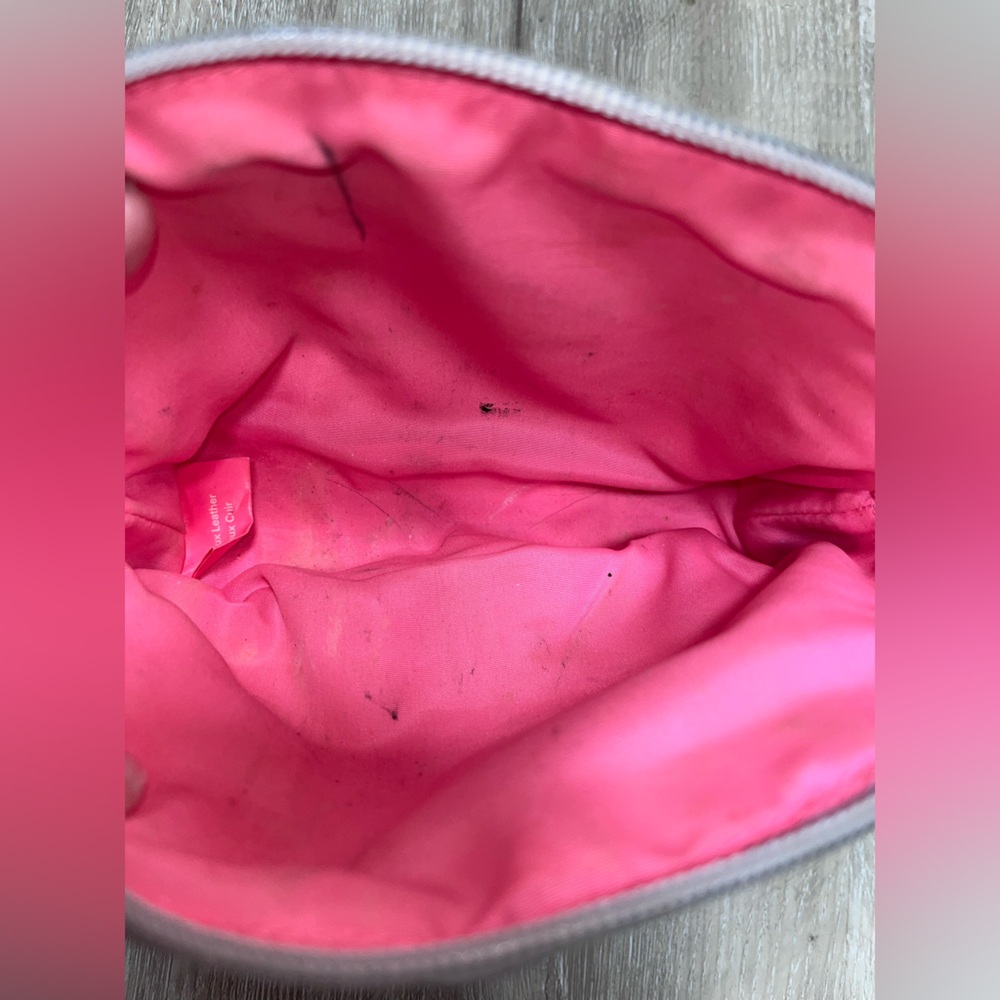 Silver Victoria’s Secret makeup bag.